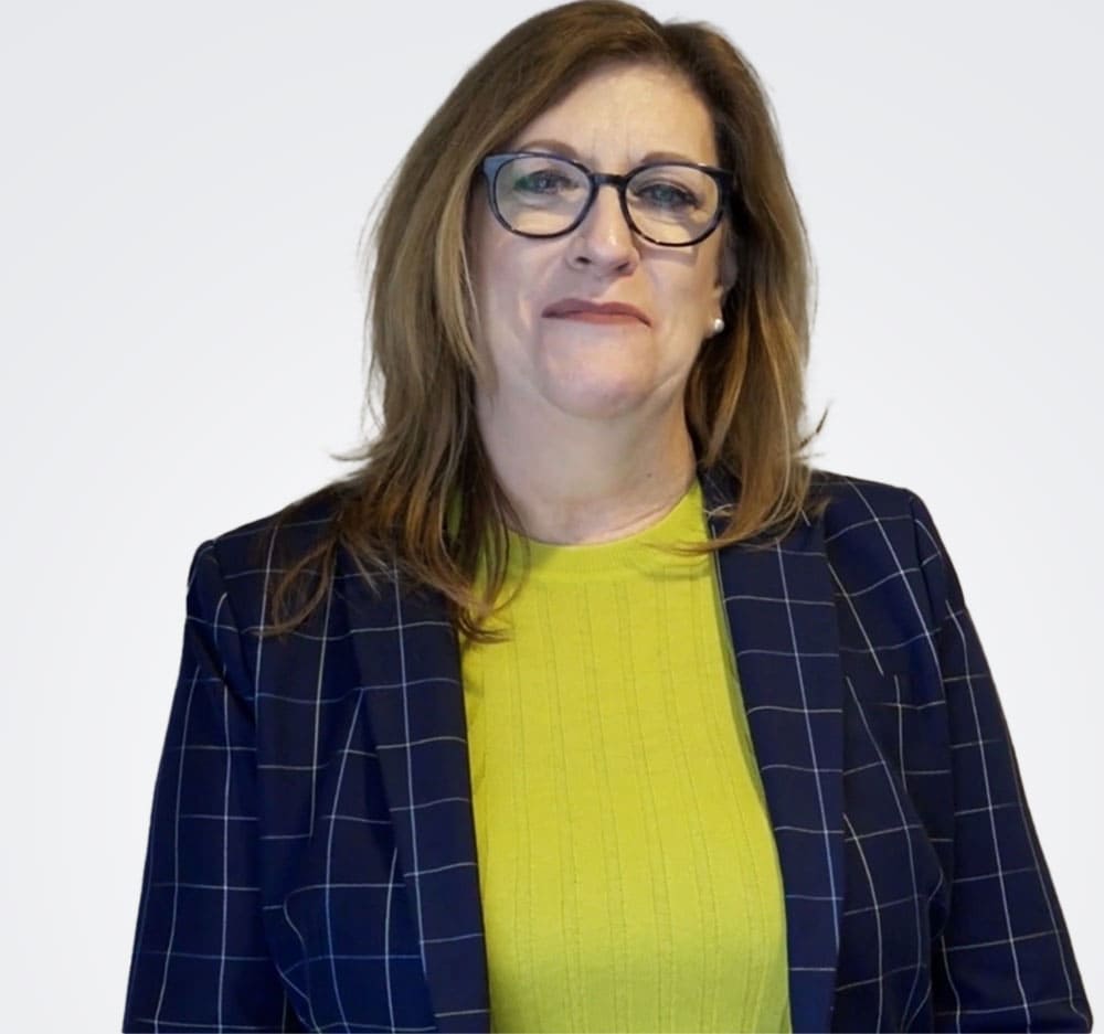 Businesswoman with glasses and blue plaid jacket