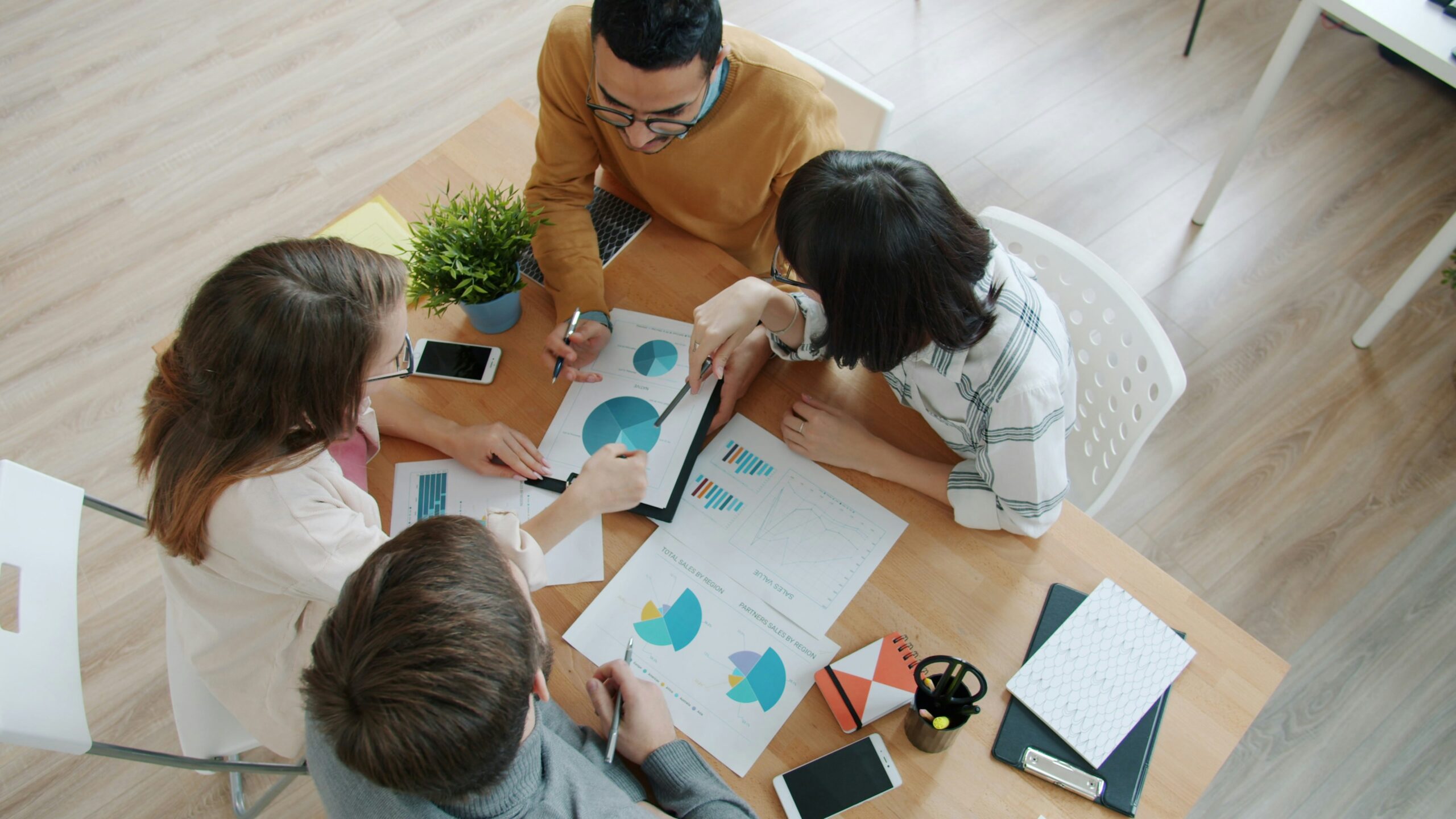 Group of marketing professionals reviewing data analytics